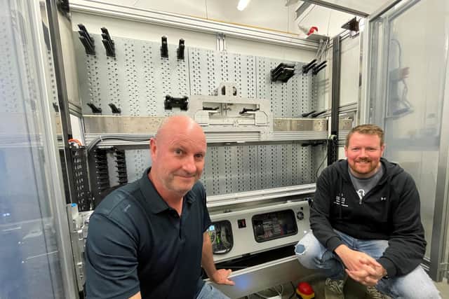Dave Bowyer and Steve Kennington in front of part of the robot system